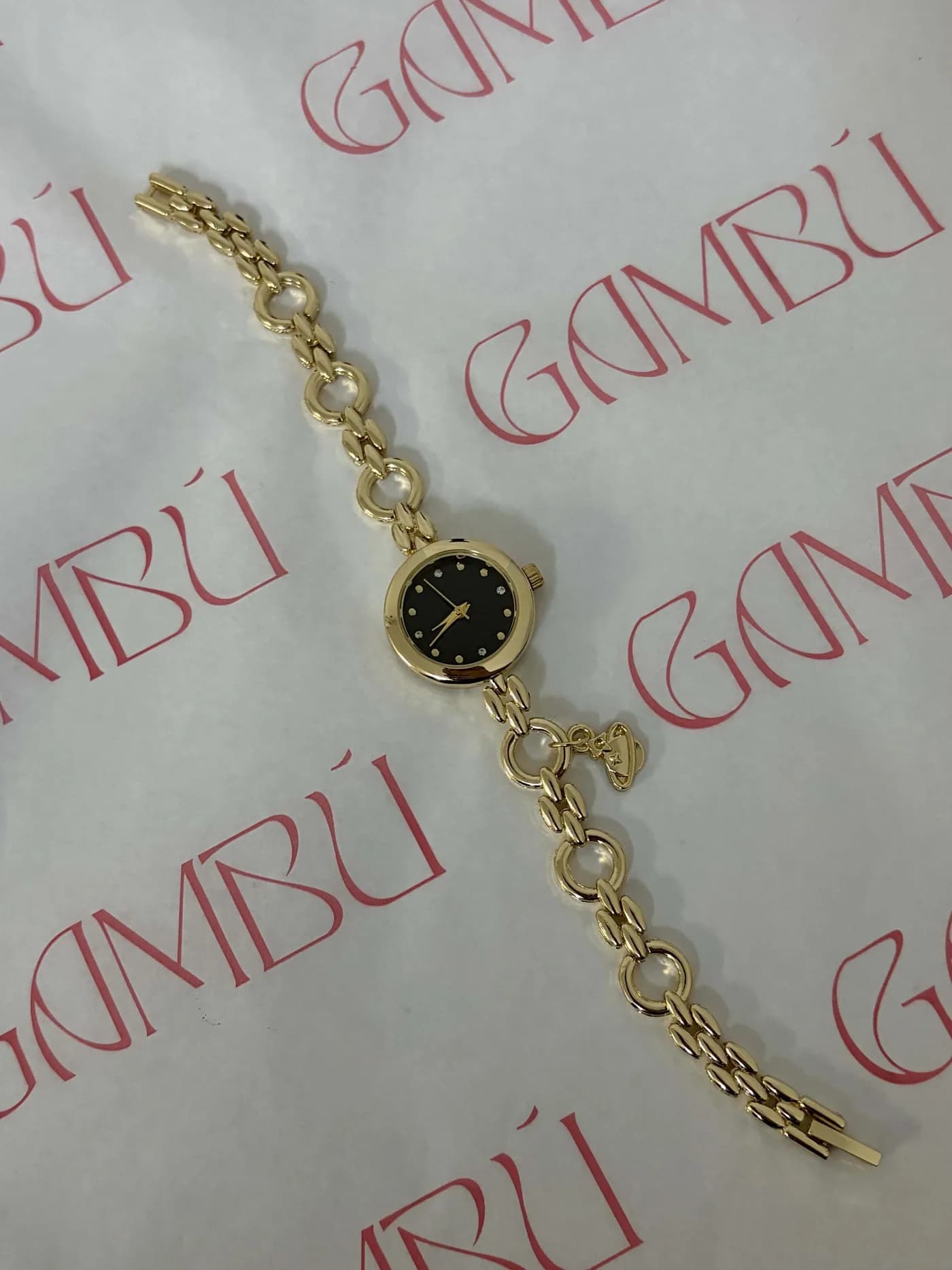 Siyah Kadranlı Gezegen Figürlü Altın Renk Kadın Kol Saati